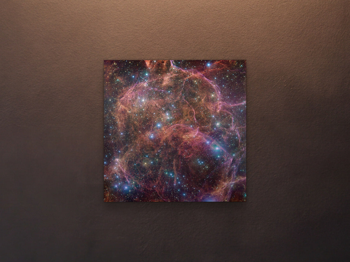Vela supernova remnant - Metal Print 40 × 40 cm shown in a black salon wall under a picture light - scale render at 40 × 40 cm