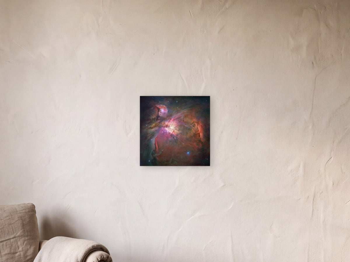 Orion Nebula shown in a limewash reading corner beside an armchair and a floor lamp - scale render at 40 × 40 cm