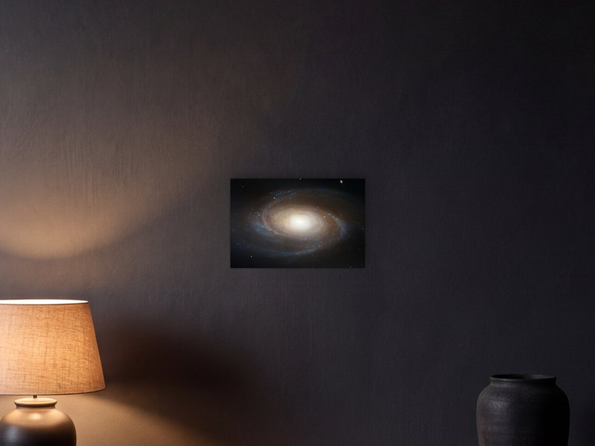 spiral galaxy M81 shown in a graphite plaster wall at night, lit by a console lamp - scale render at 45 × 30 cm