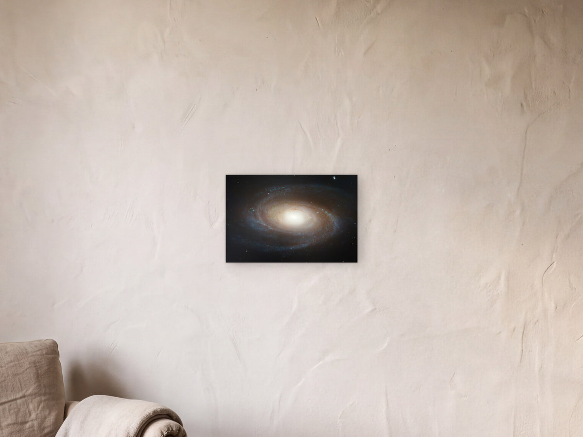 spiral galaxy M81 shown in a limewash reading corner beside an armchair and a floor lamp - scale render at 45 × 30 cm